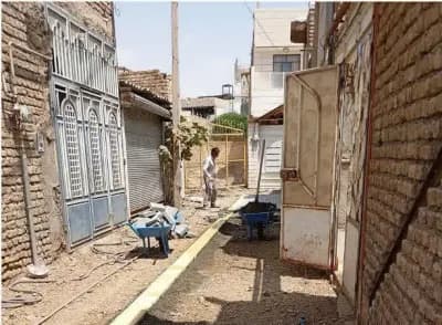 گزارش تصویری| عملیات‌نصب تایل بتنی کوچه معلم ۹/۱