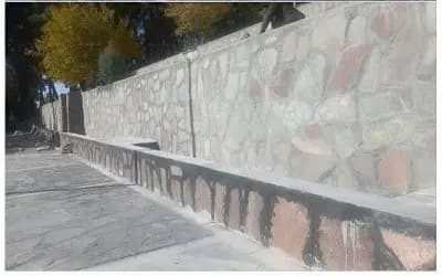 ادامه عملیات سنگ چینی دیواره آبشارسیدمرتضی (ع)